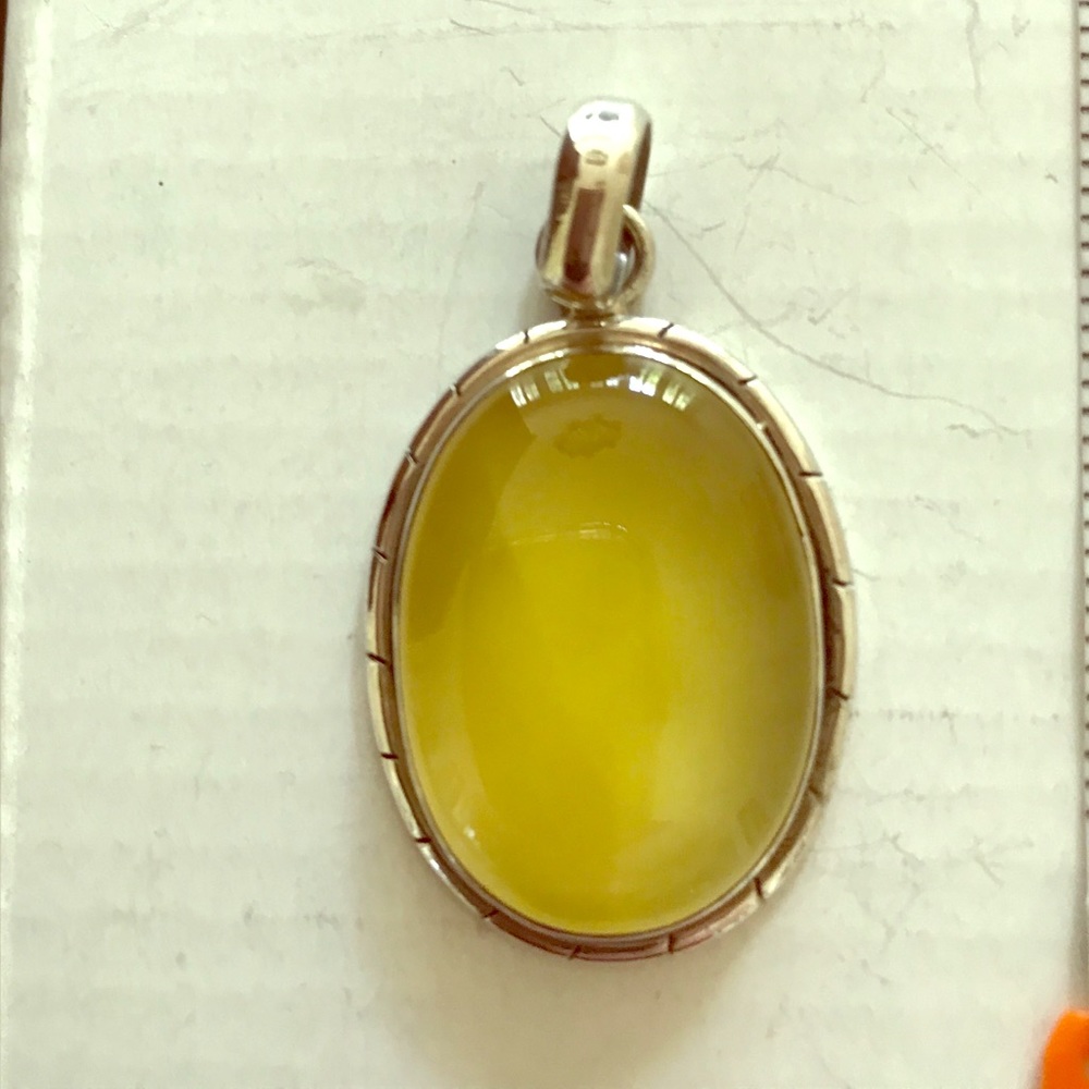 Sterling silver pendant with yellow stone